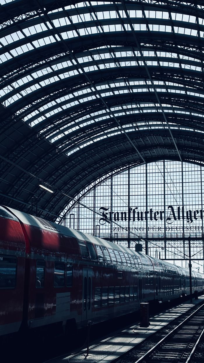 portfolio-06 A vibrant train inside Frankfurt Central Station with its iconic architectural archways and signage.